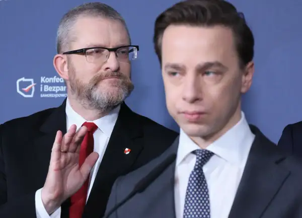 Dwóch mężczyzn w garniturach, jeden z brodą i okularami, drugi z wyrazem twarzy.